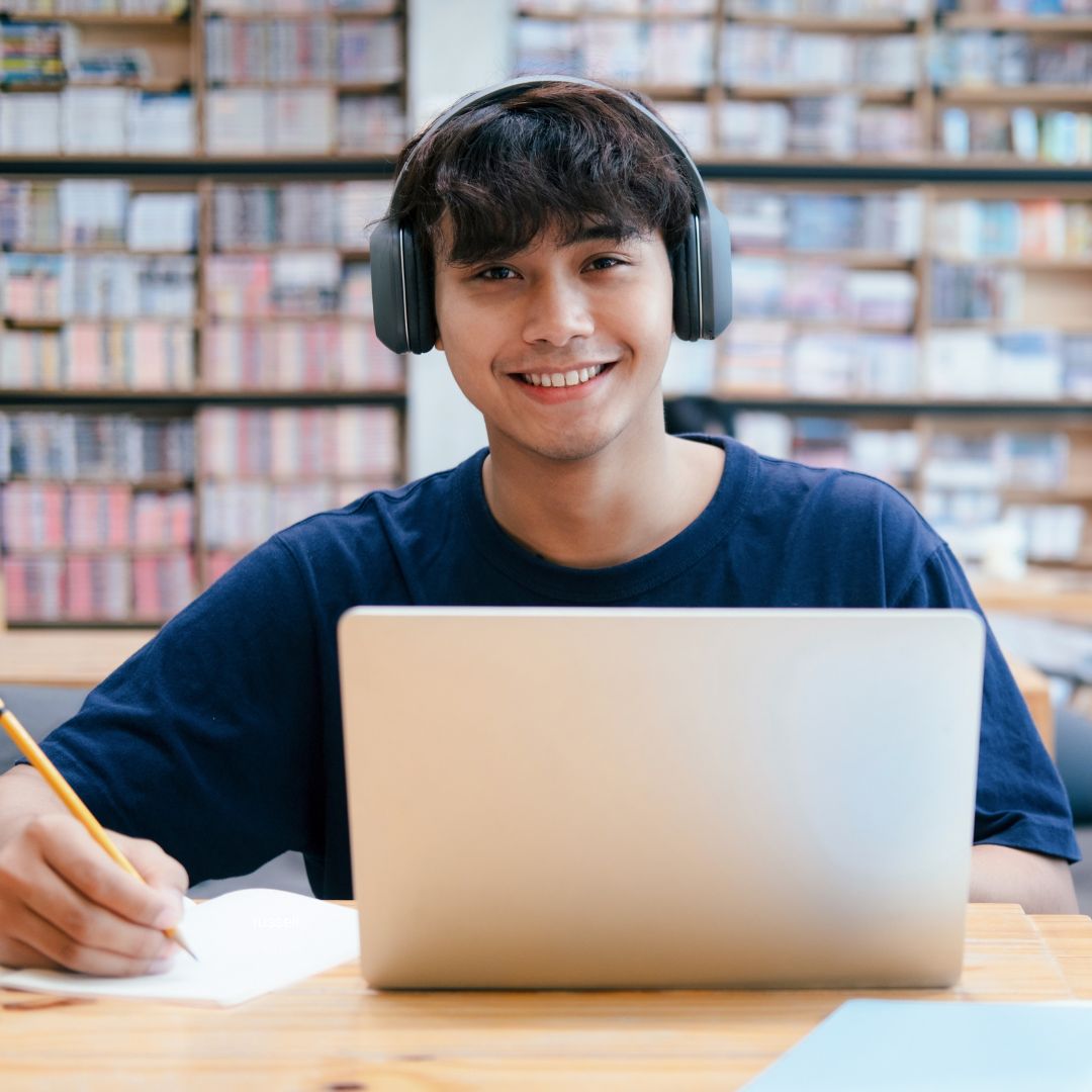 Student using a laptop in the library